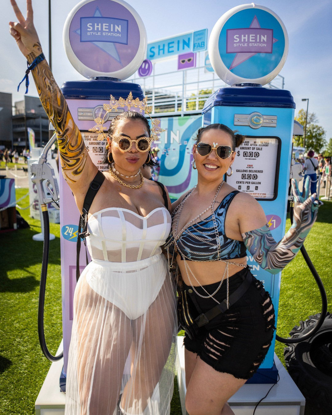 Guests posing with SHEIN festival signage