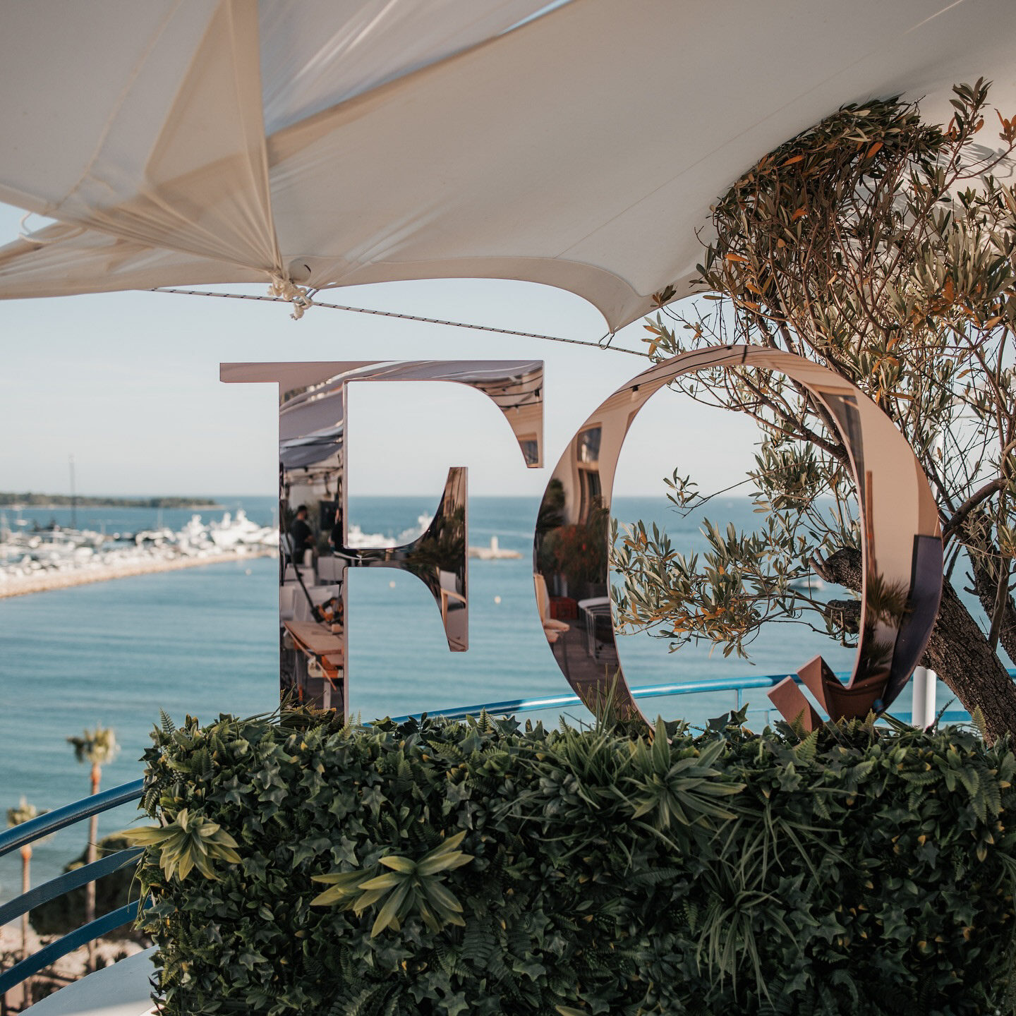 Mirrored Female Quotient monogram overlooking the Mediterranean in Cannes