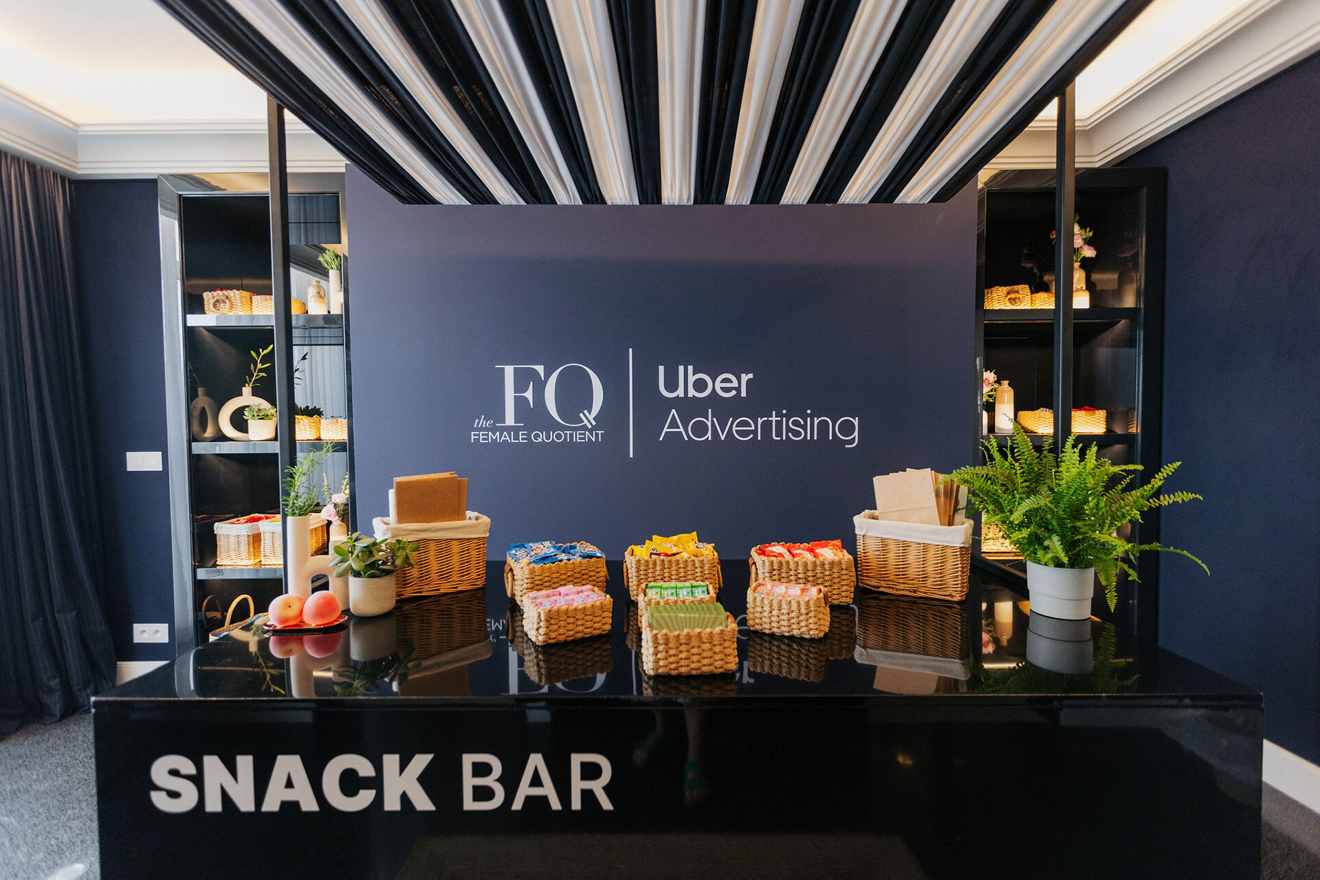 FQ and Uber Advertising partner snack bar inside the lounge