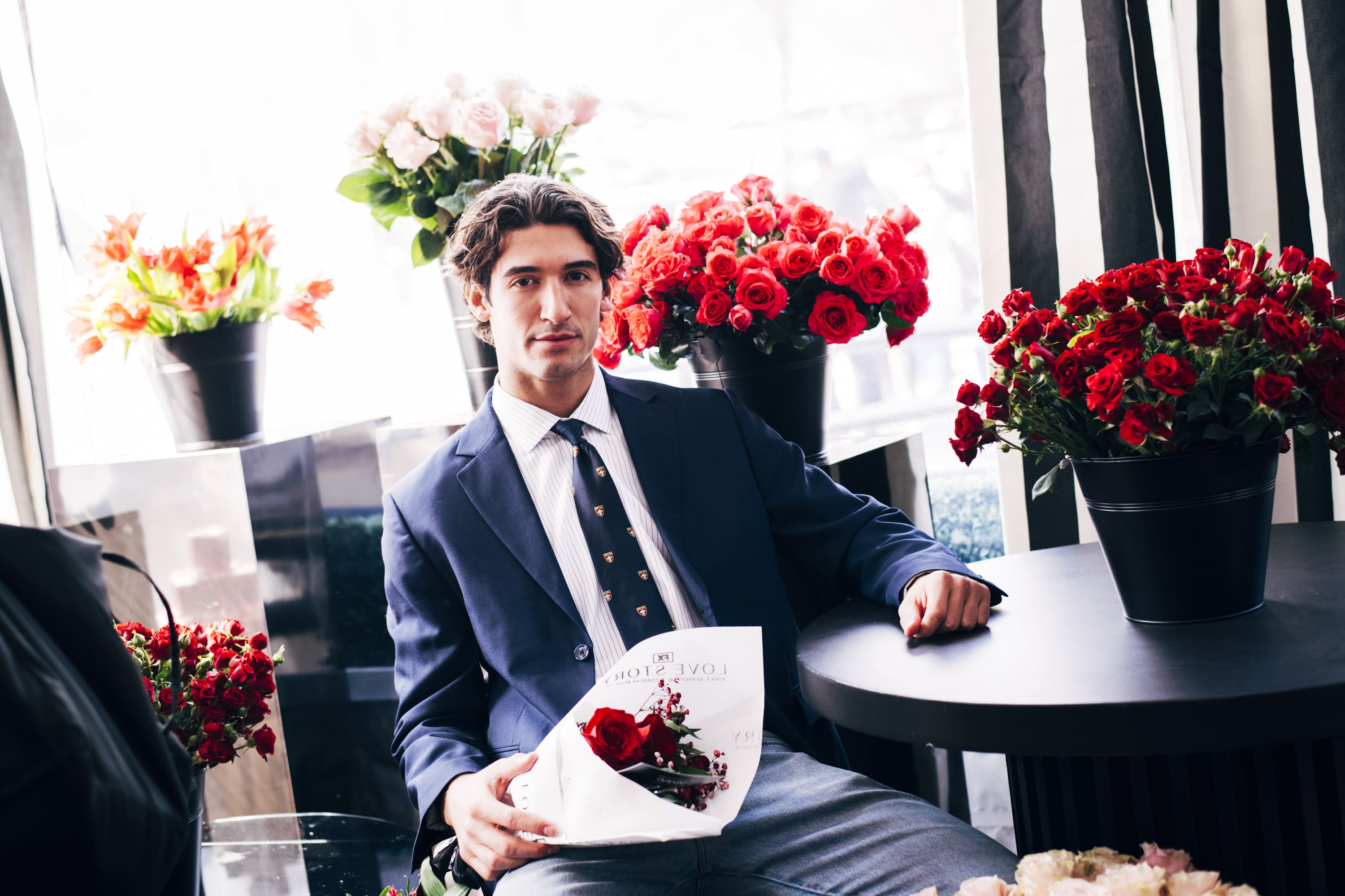 A guest holding a bouquet at Wollman Rink