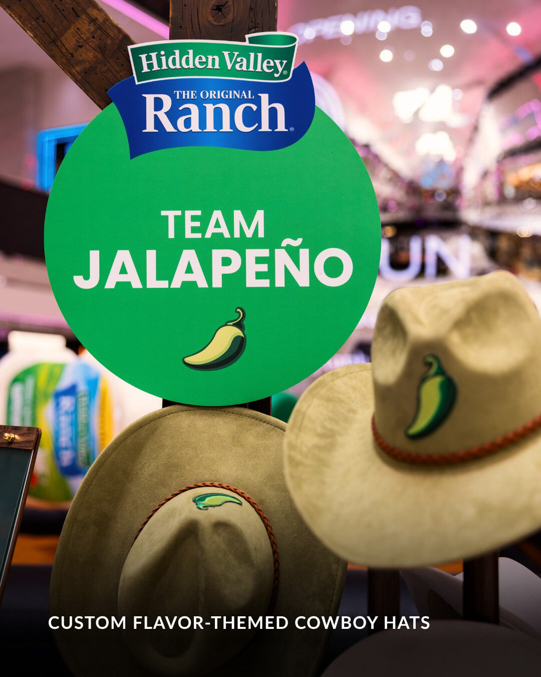Team Jalapeño signage and custom flavor-themed cowboy hats