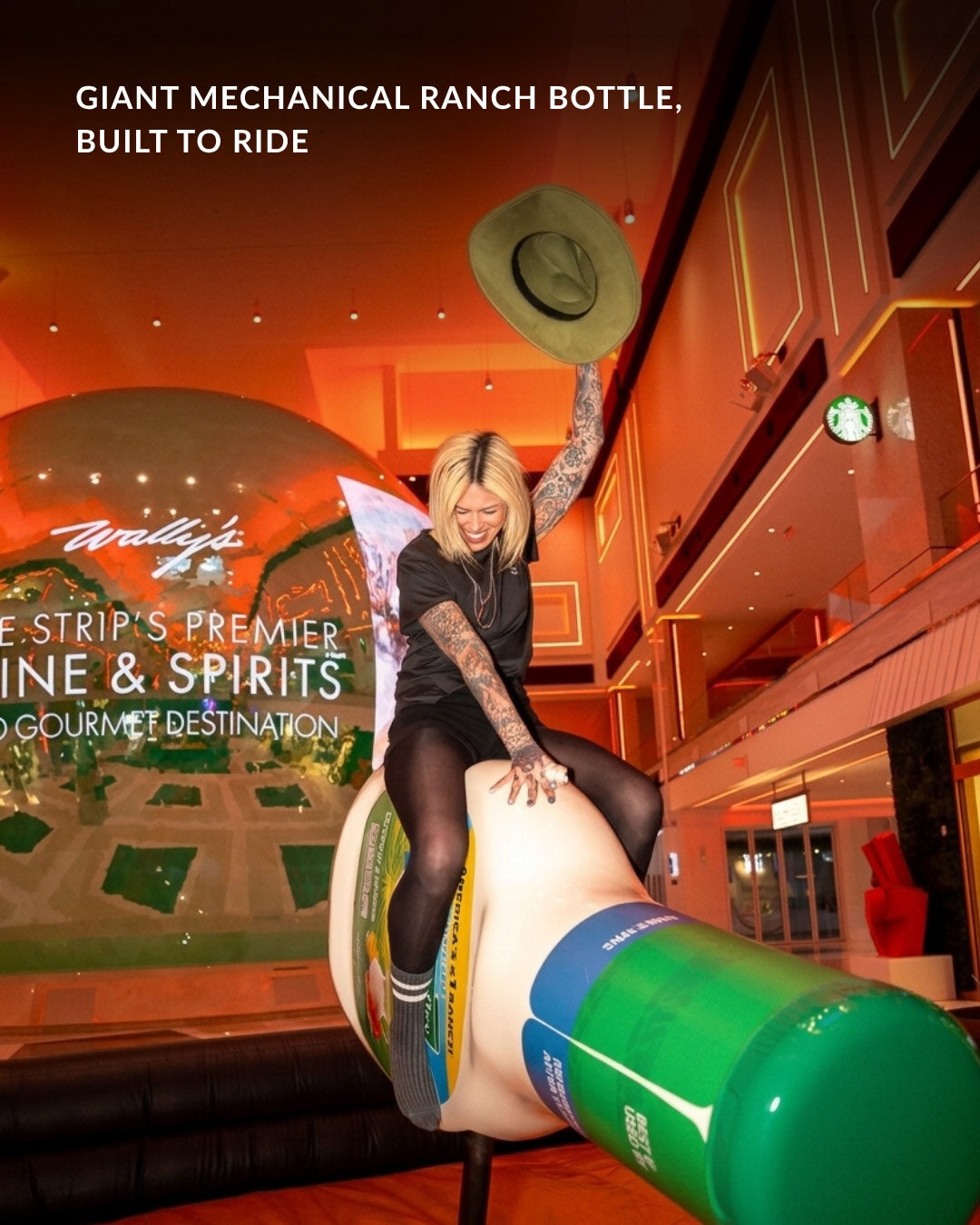 Guest riding the giant mechanical Hidden Valley Ranch bottle