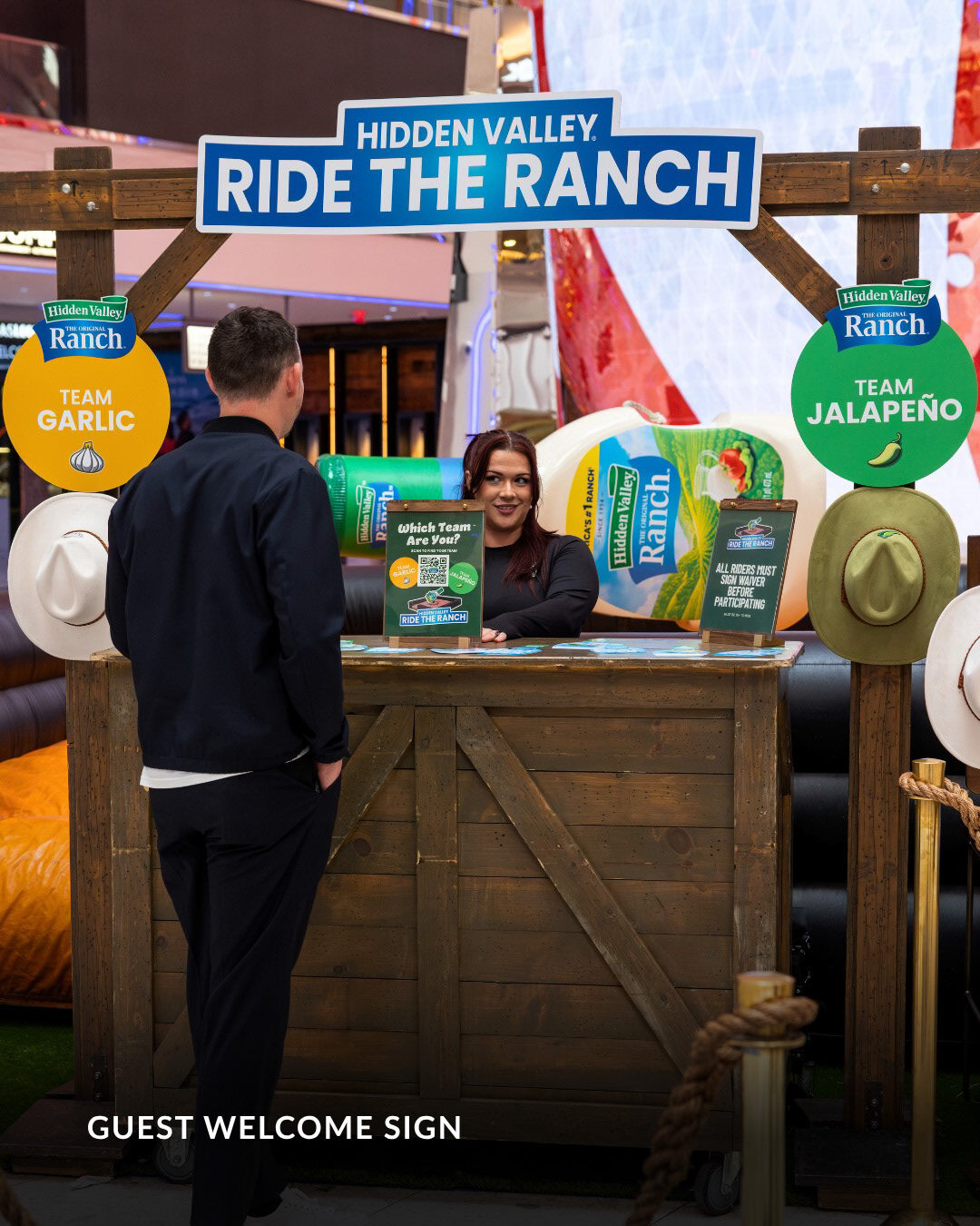 Ride The Ranch guest welcome station with Team Garlic and Team Jalapeño signage