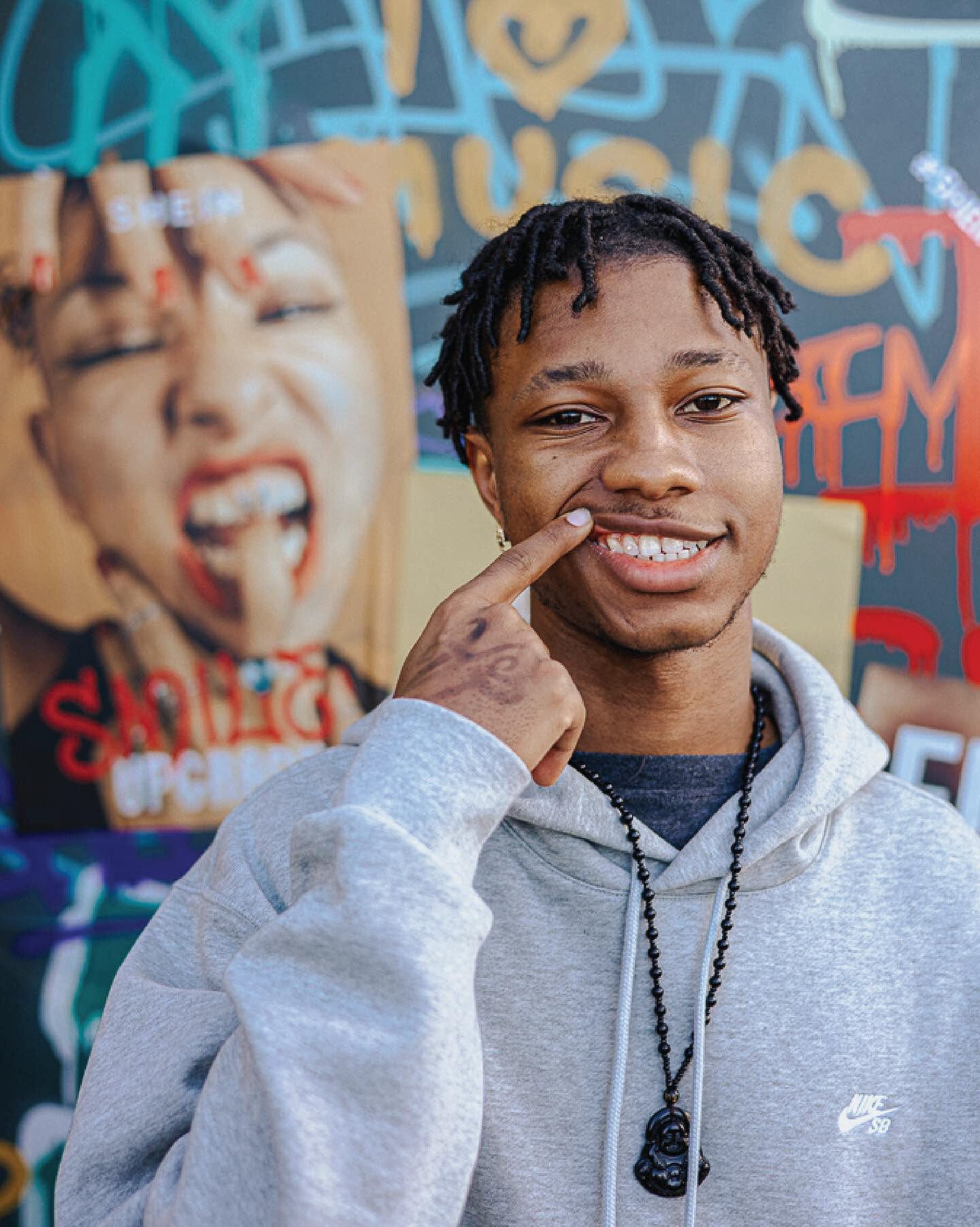 Rolling Loud guest showing a new tooth gem at SHEIN Street