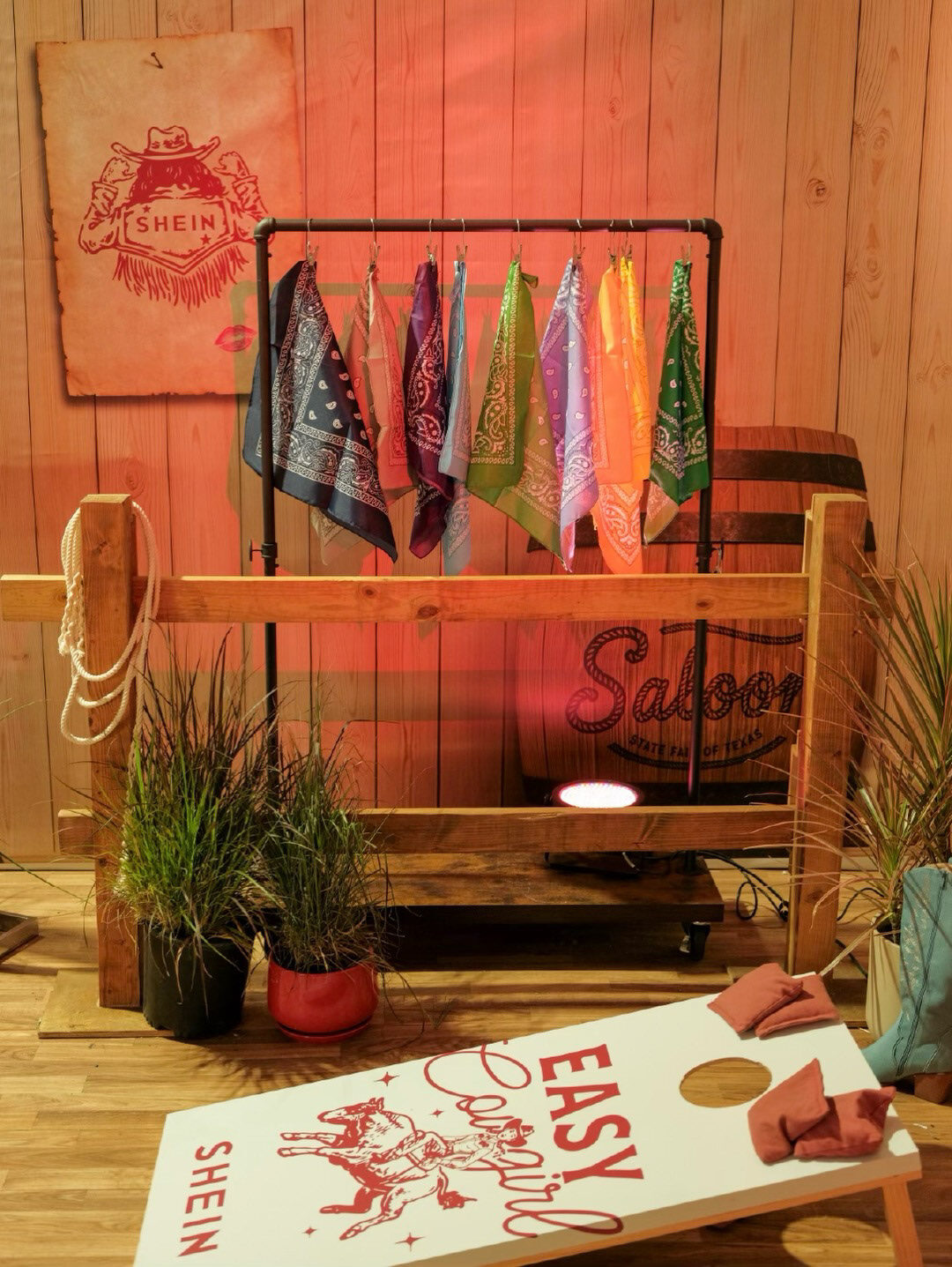 Bandanas and cornhole inside the SHEIN Saloon customization area