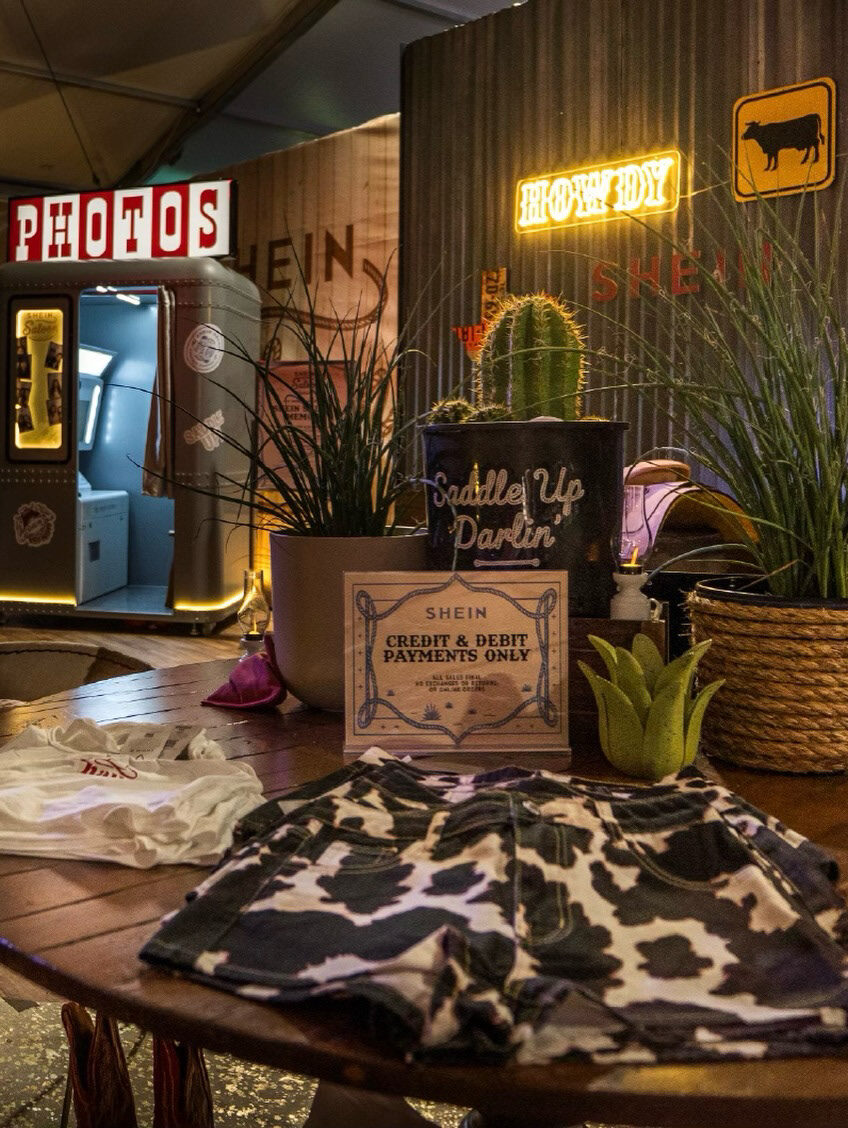 Customization table beside the SHEIN Saloon photo booth