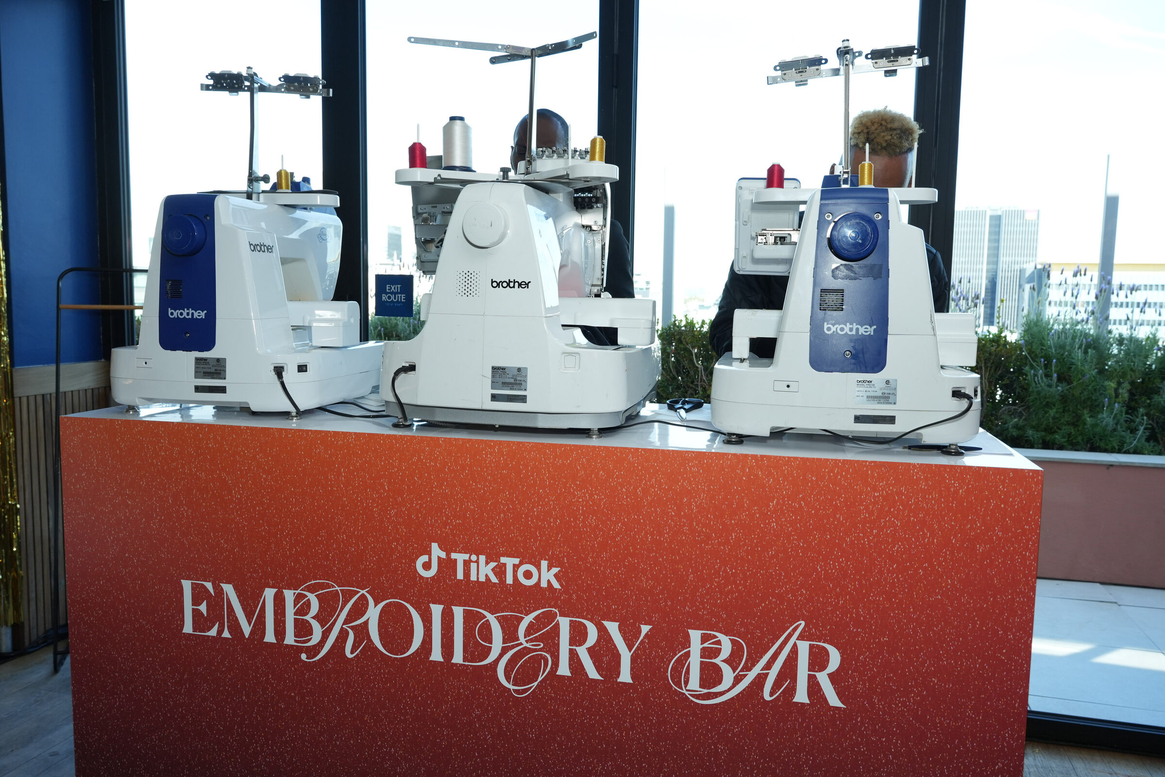 The branded TikTok Embroidery Bar with live stitching stations