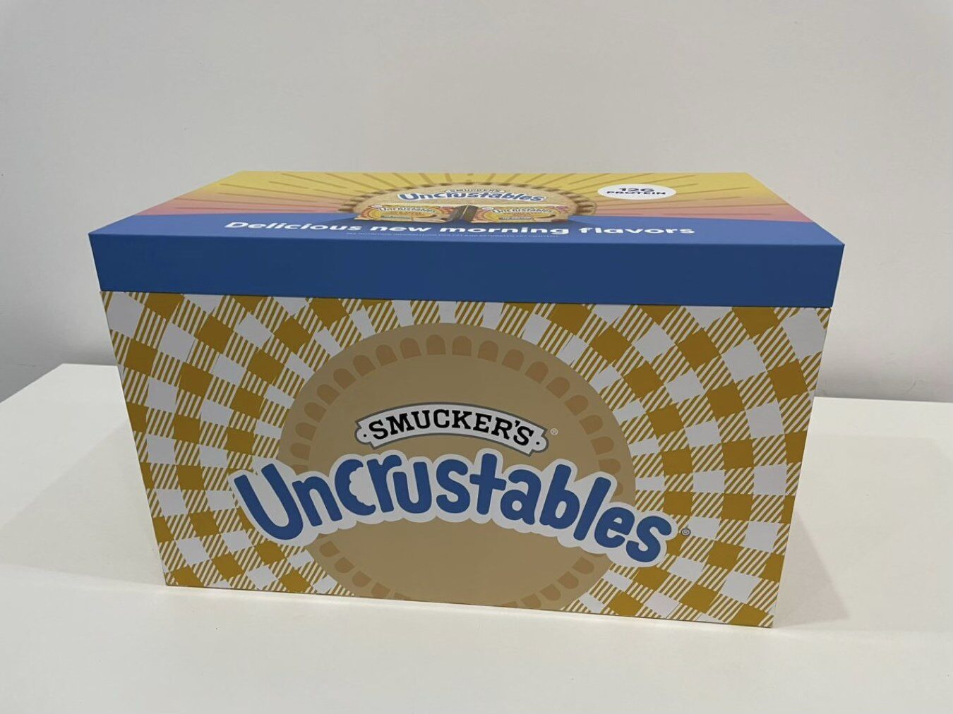 Closed Uncrustables protein seeding presentation box
