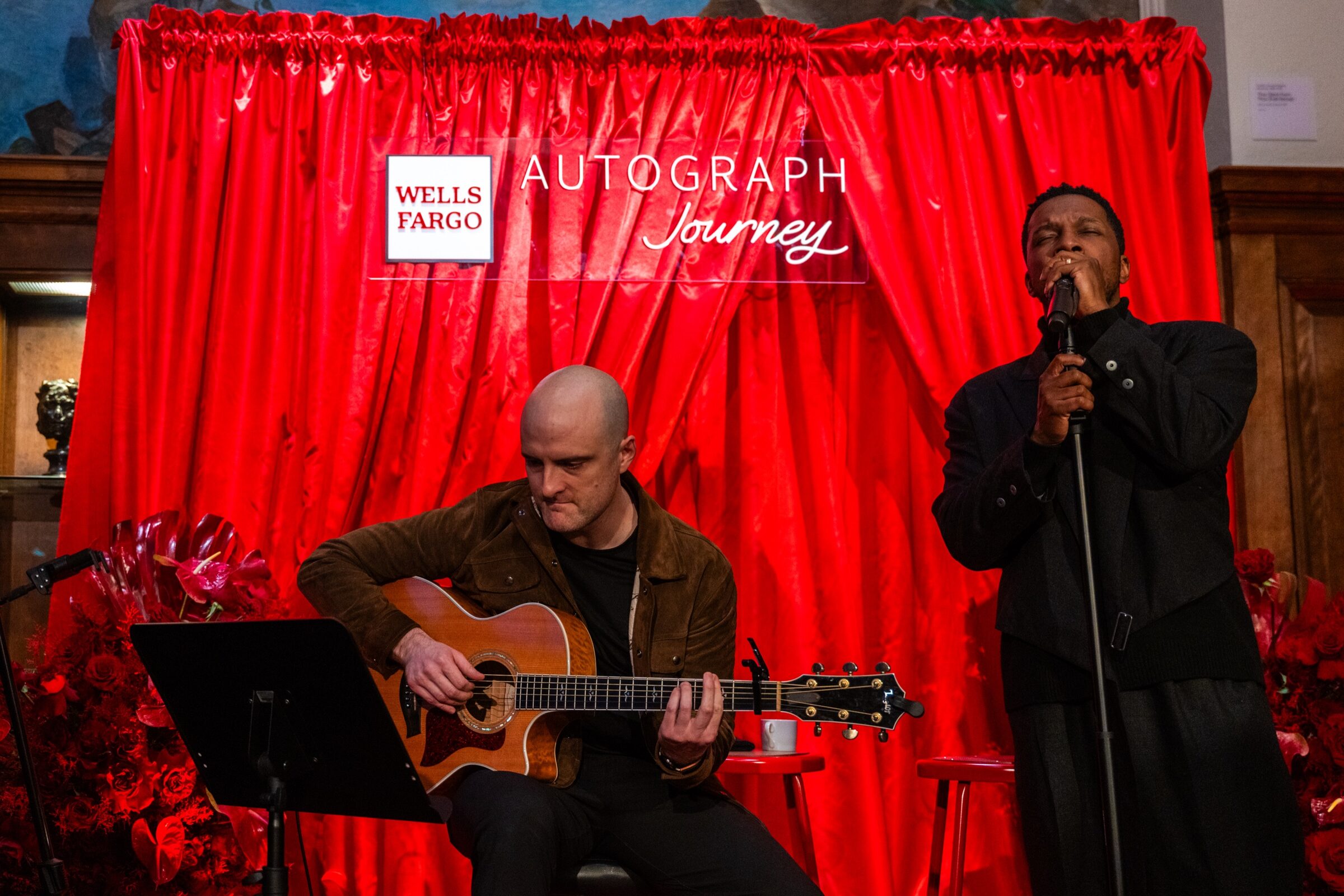 Leslie Odom Jr performing against the branded Wells Fargo Autograph Journey backdrop