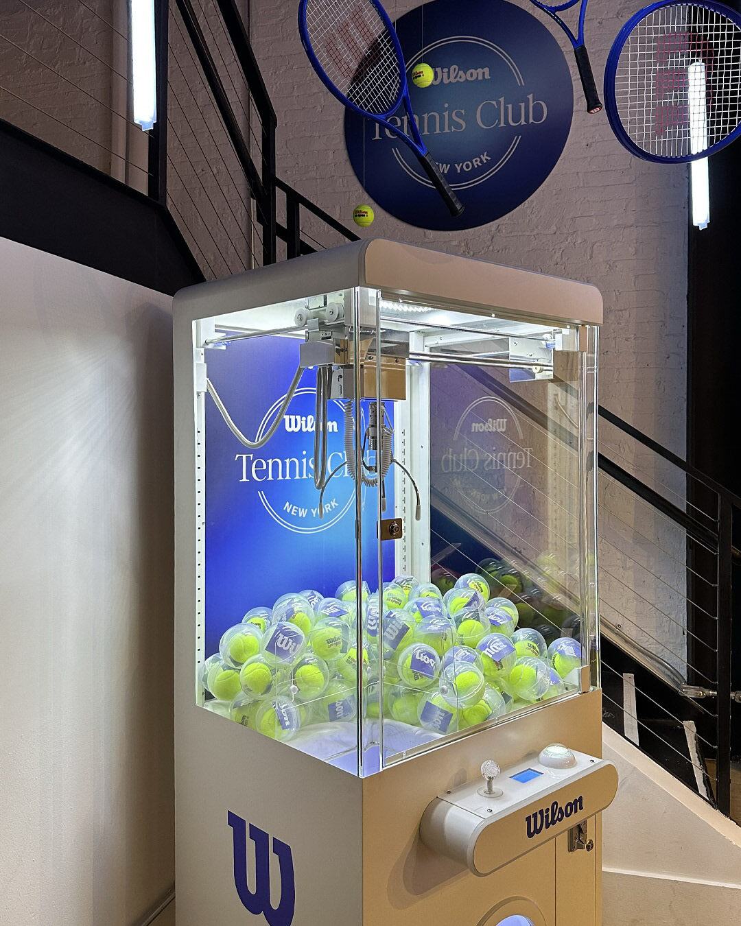 Wilson-branded tennis ball claw machine