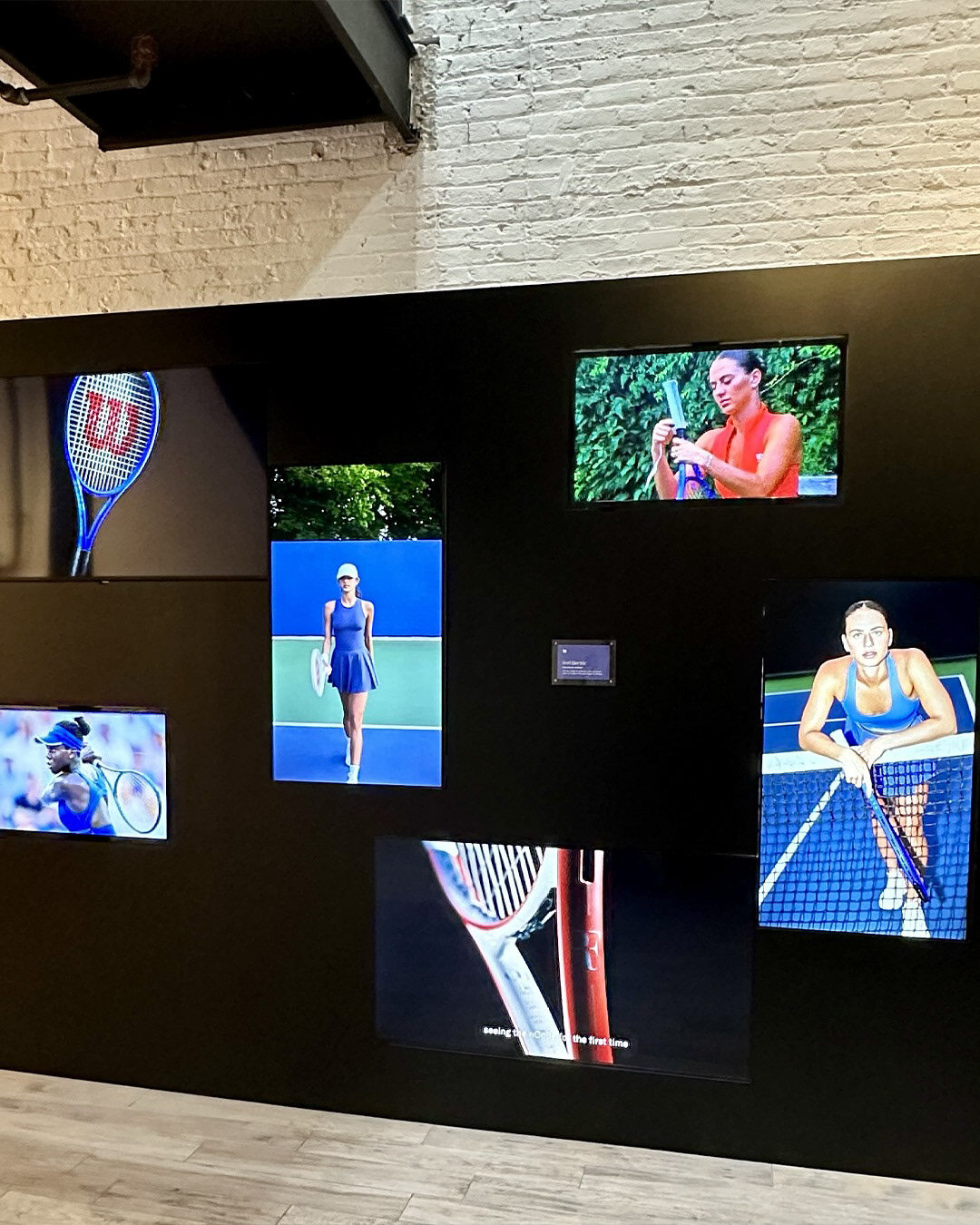 Wilson Tennis Club media wall featuring tennis imagery