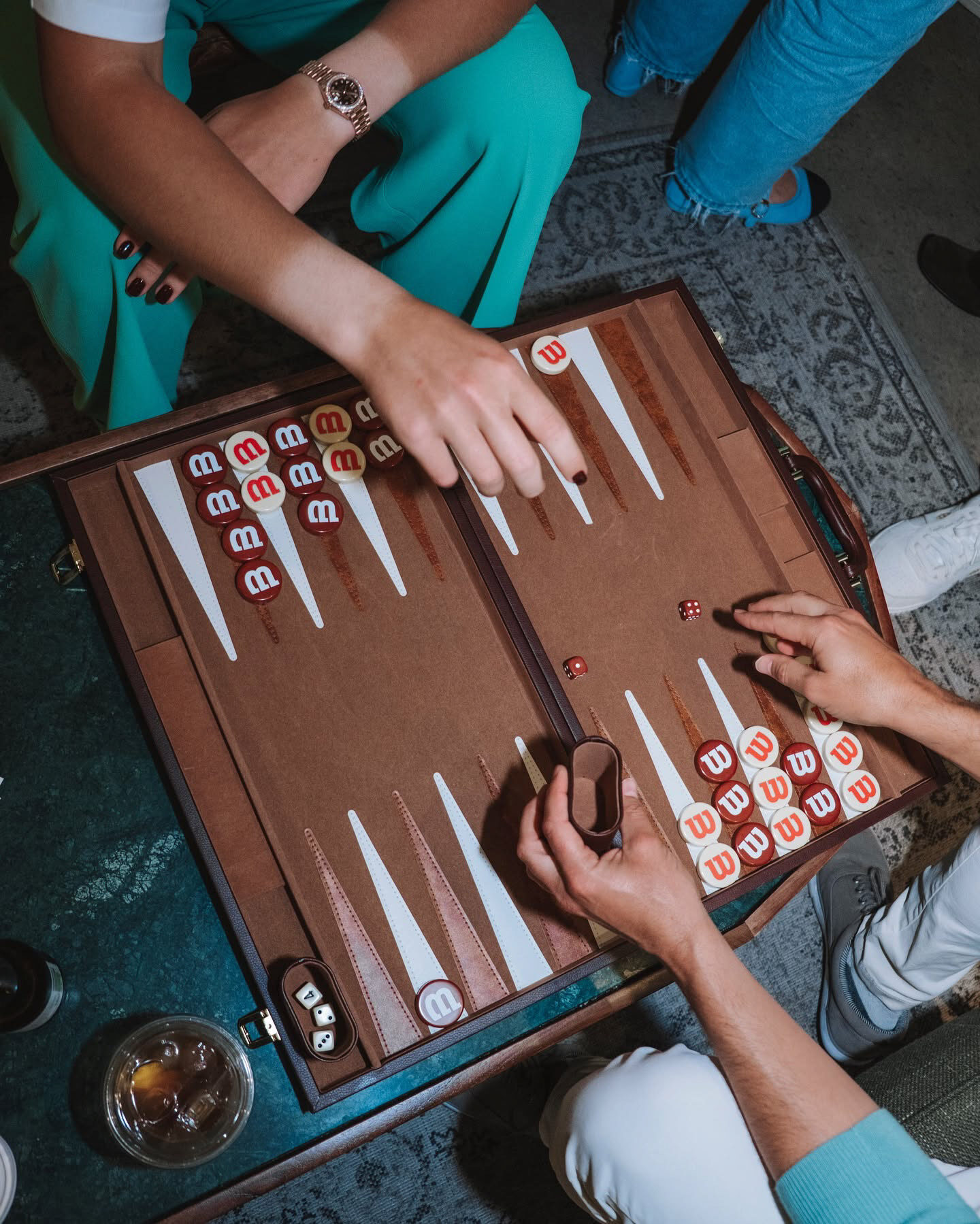 Guests playing backgammon at Wilson Tennis Club Paris