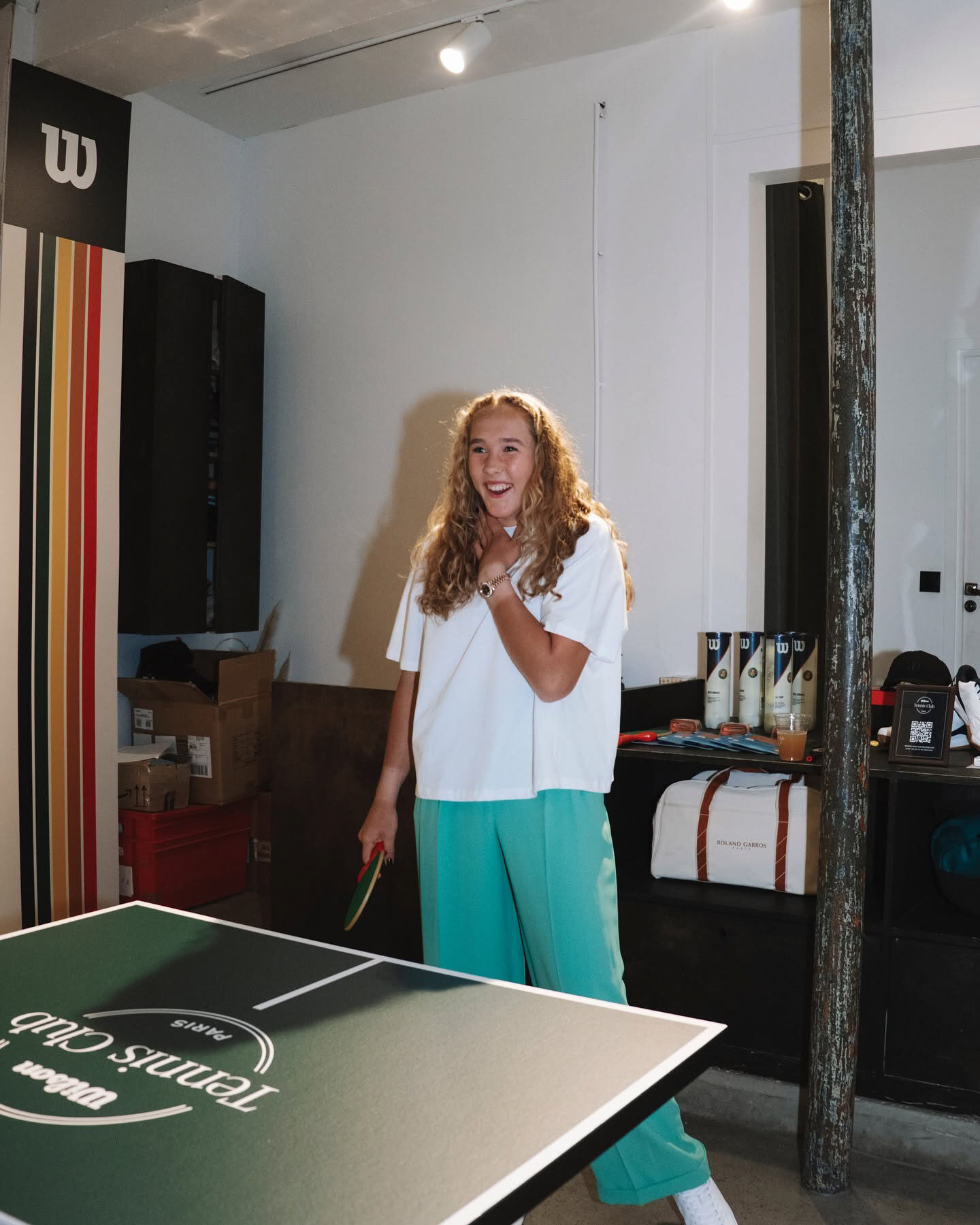 Guest playing table tennis inside Wilson Tennis Club Paris